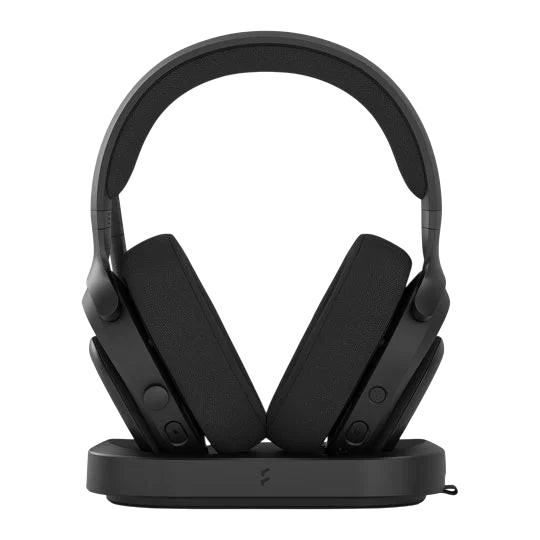 Kryoshift Fractal Design Scape Dark wireless gaming headset in black with fabric ear cups on a charging dock stand