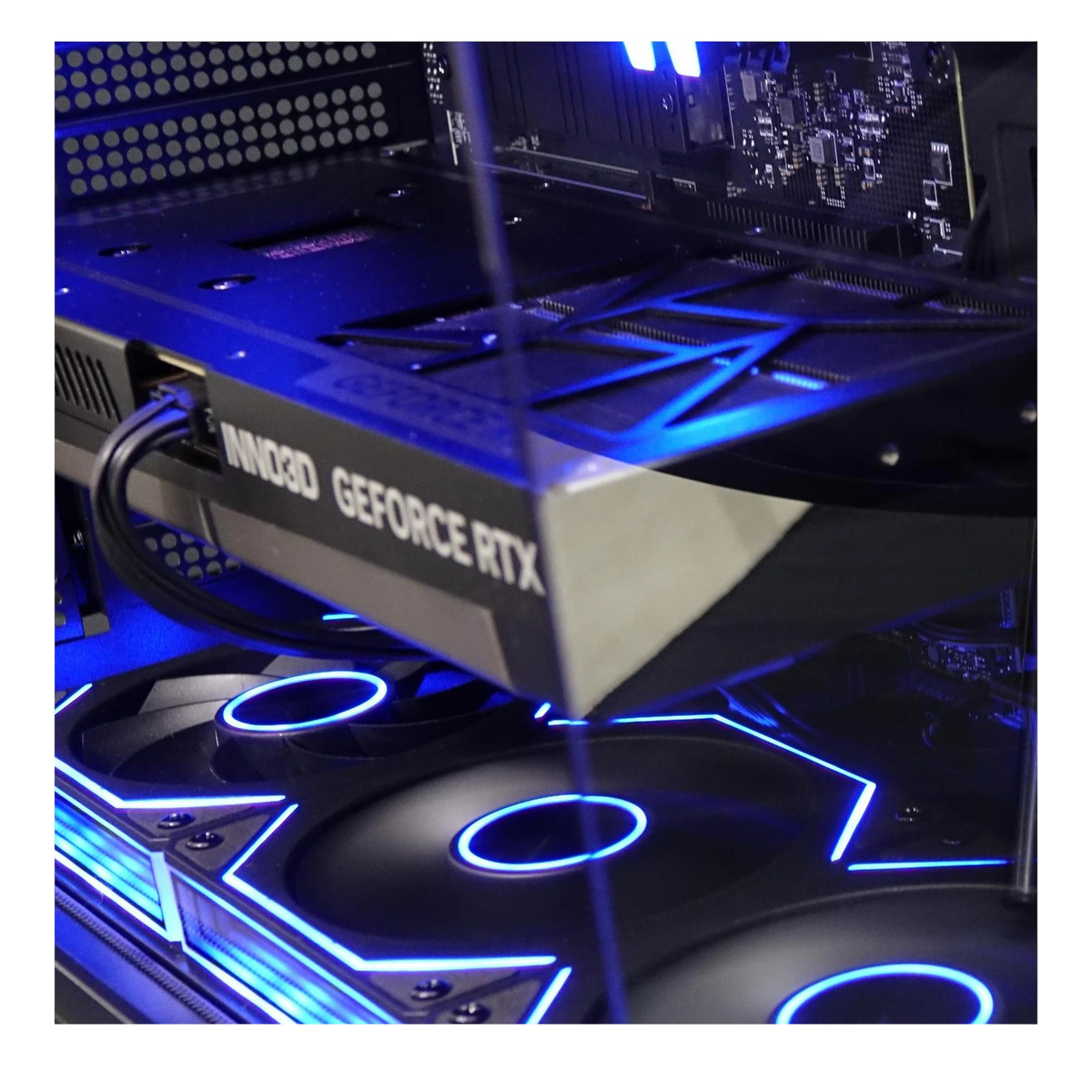 Kryoshift Pulse 5060 Ti gaming PC interior featuring an Inno3D GeForce RTX graphics card and blue LED cooling fans.