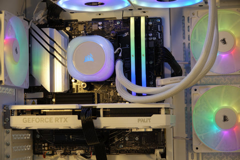 Kryoshift Pulse White 5060 gaming PC interior with white liquid cooler, RGB fans, and white Palit GeForce RTX GPU