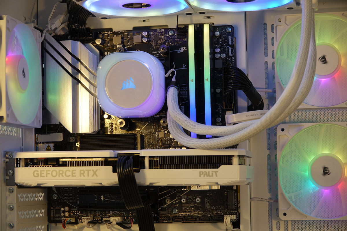 Kryoshift Pulse White 5060 gaming PC interior with white liquid cooler, RGB fans, and white Palit GeForce RTX GPU